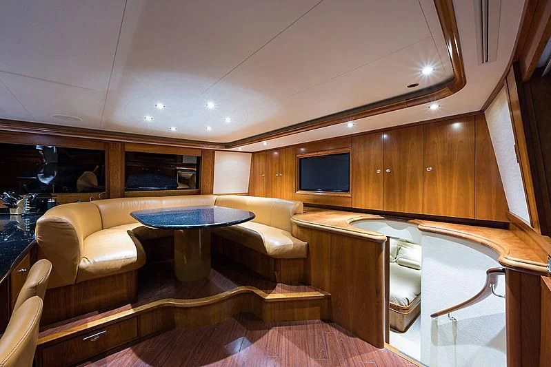 a room with a table and chairs aboard SLEEPOVER Yacht for Sale