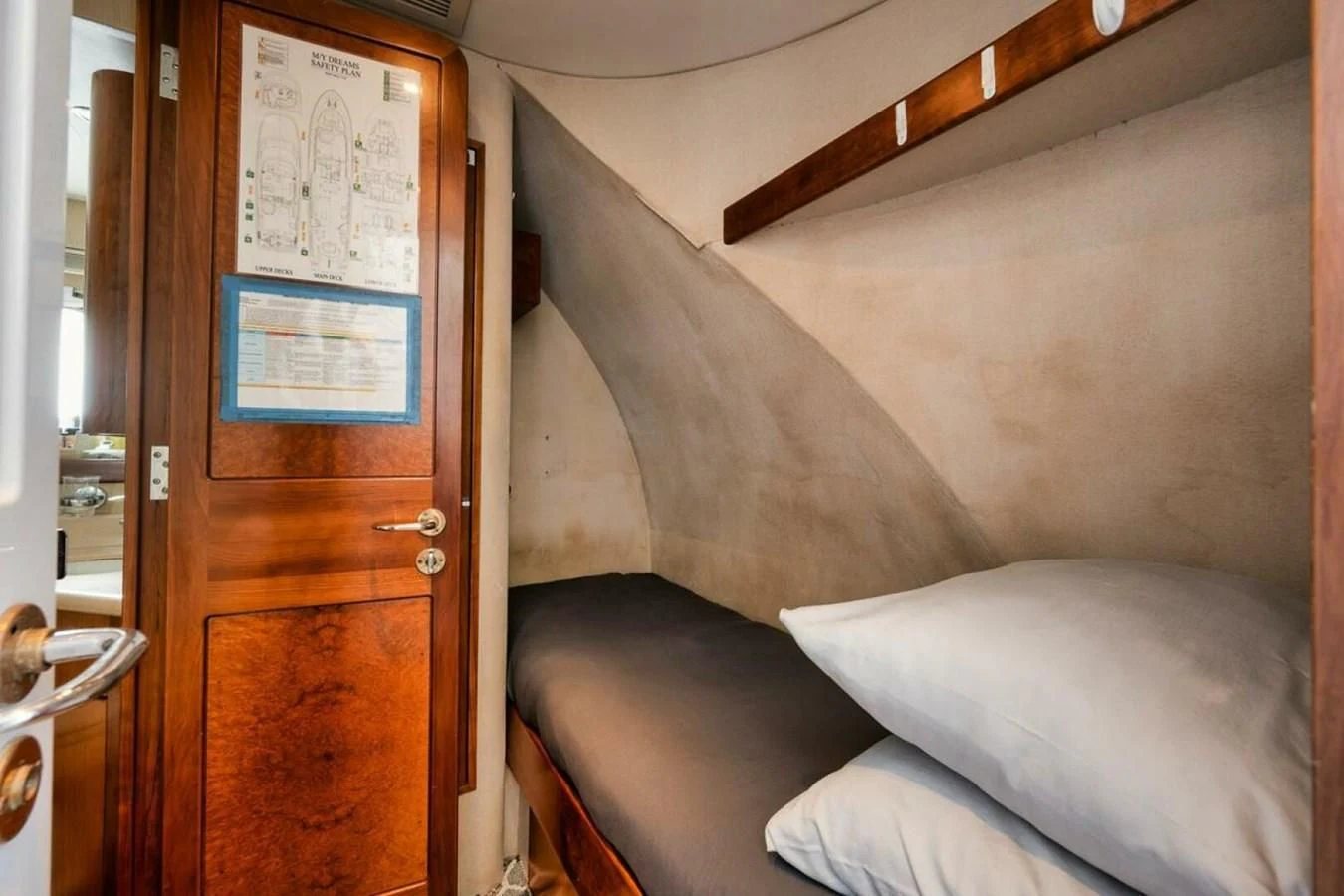 a bed in a room aboard SLEEPOVER Yacht for Sale