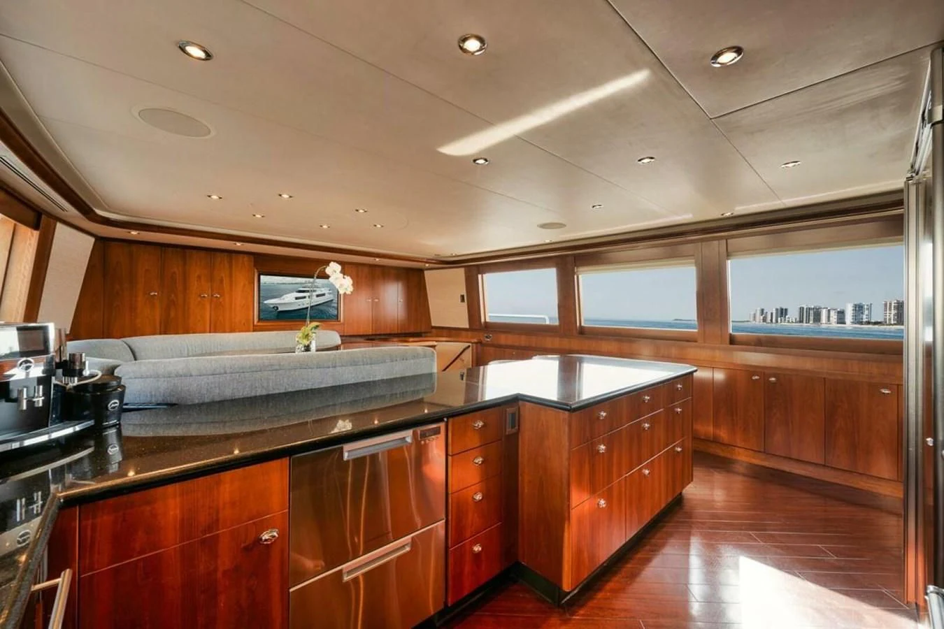a kitchen with wooden cabinets aboard SLEEPOVER Yacht for Sale