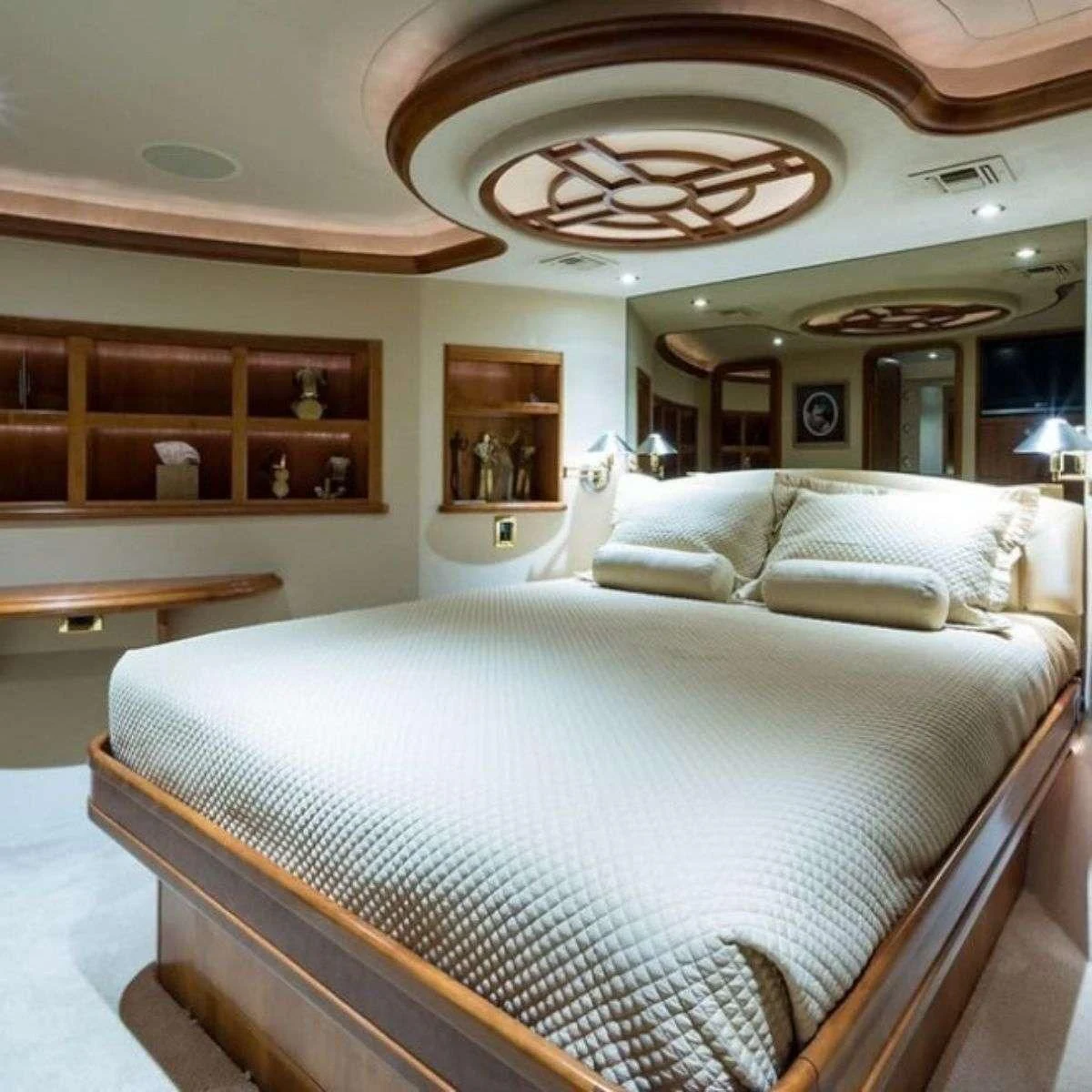 a large bed in a room aboard SLEEPOVER Yacht for Sale