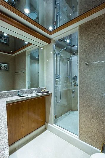 a bathroom with a glass shower aboard SLEEPOVER Yacht for Sale