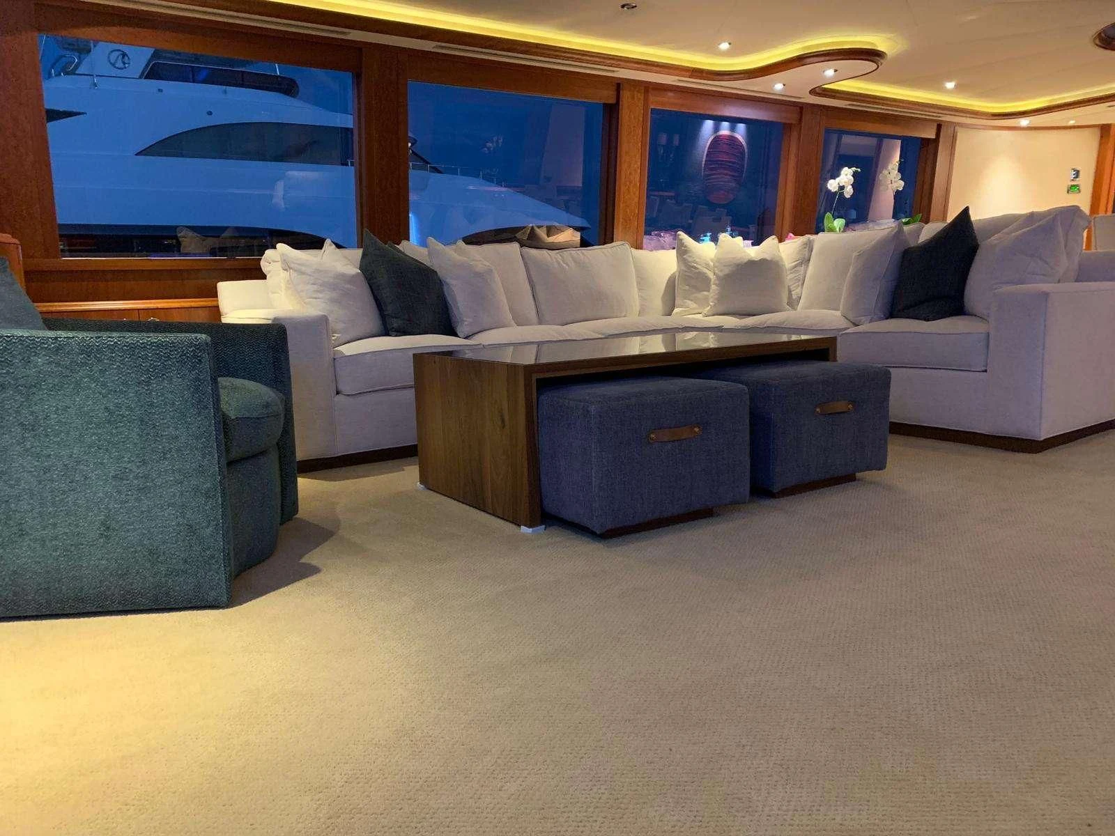 a living room with a couch and a tv aboard SLEEPOVER Yacht for Sale