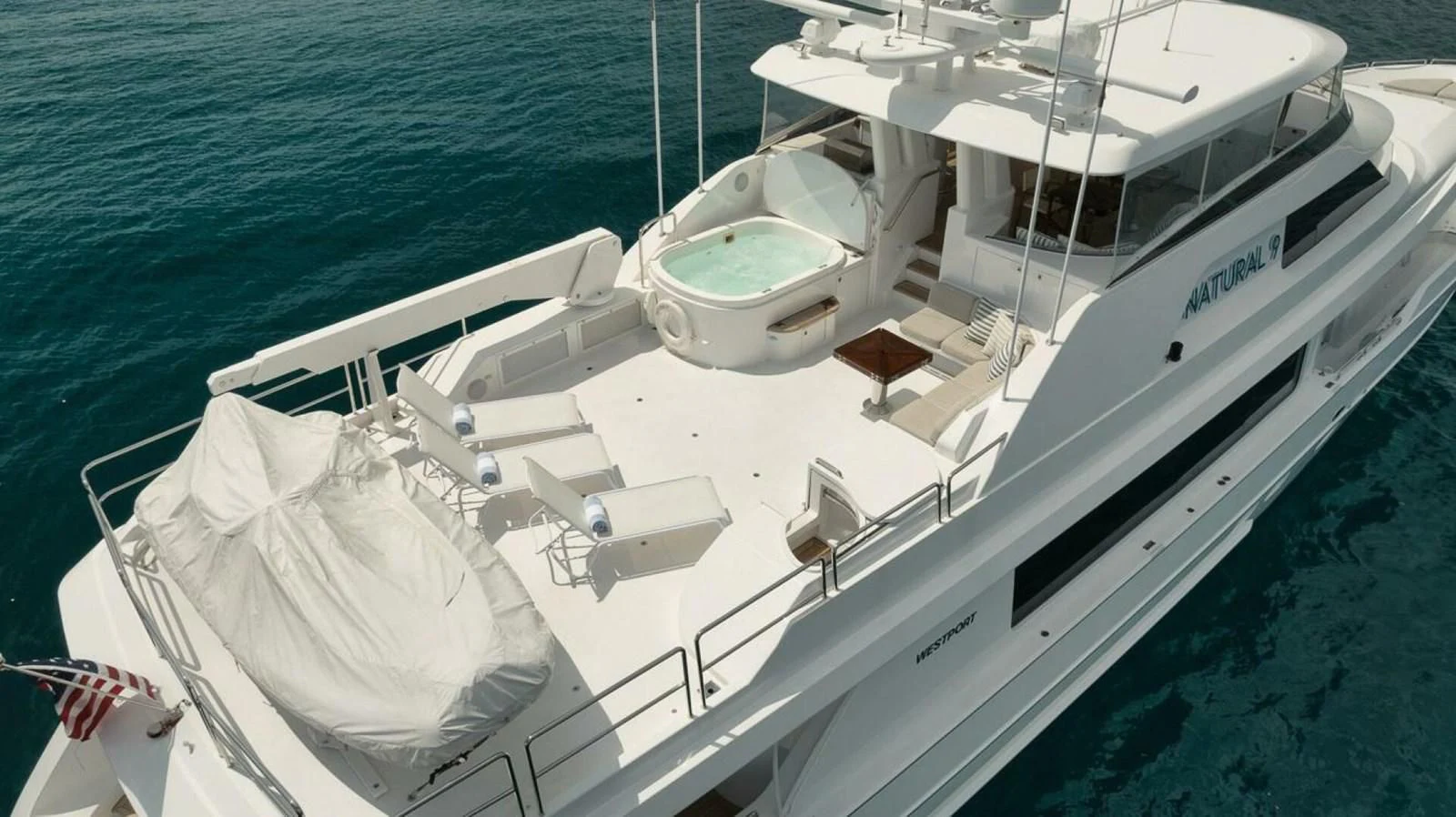 a white boat on the water aboard SLEEPOVER Yacht for Sale