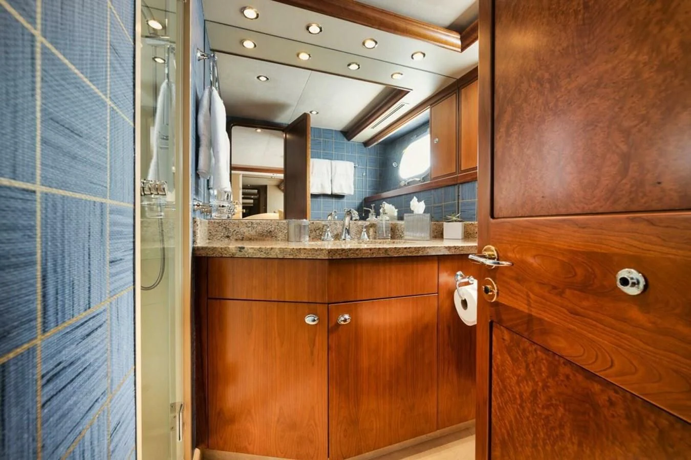 a bathroom with a countertop sink and cabinets aboard SLEEPOVER Yacht for Sale
