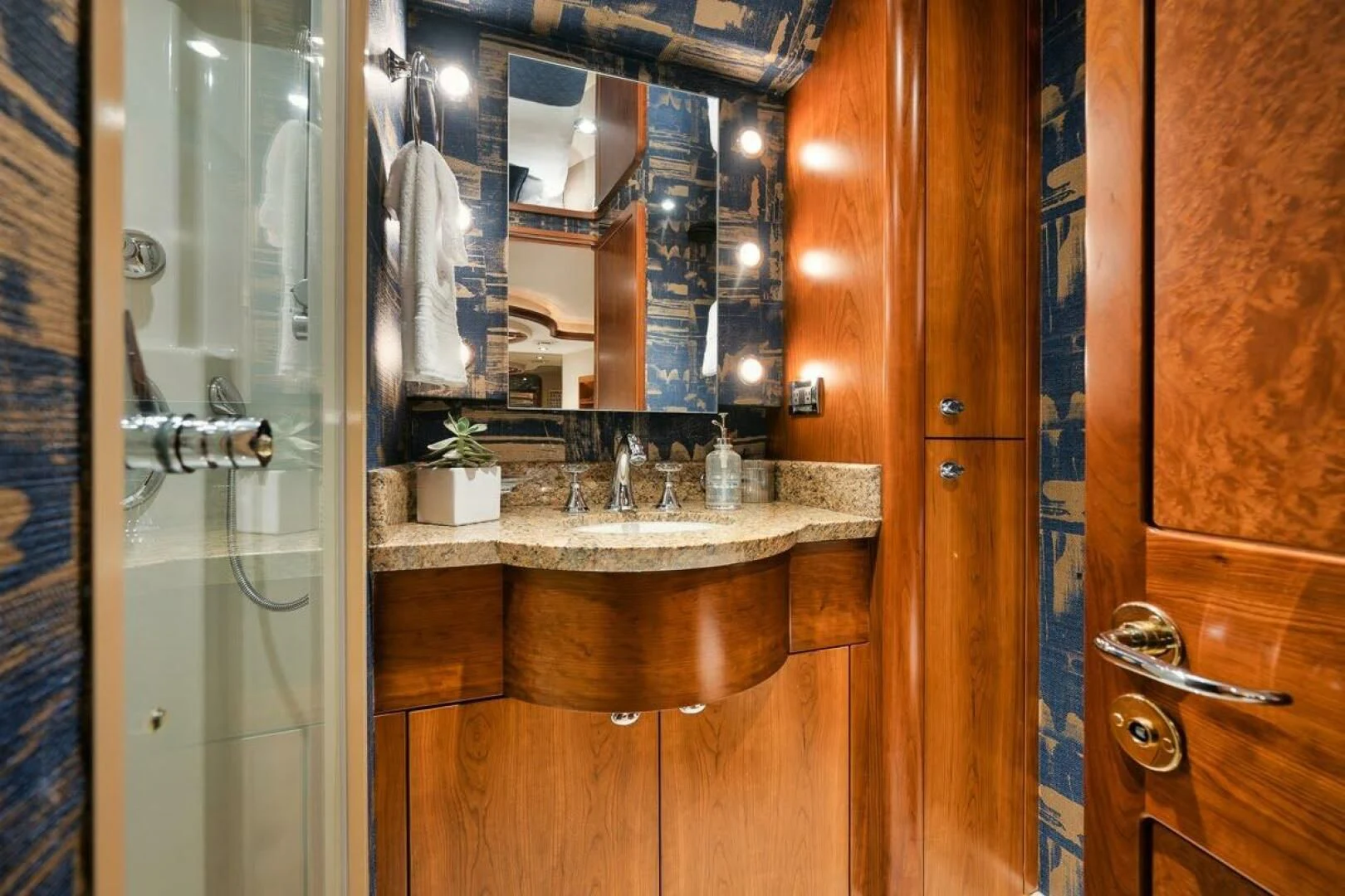 a bathroom with a sink and a mirror aboard SLEEPOVER Yacht for Sale