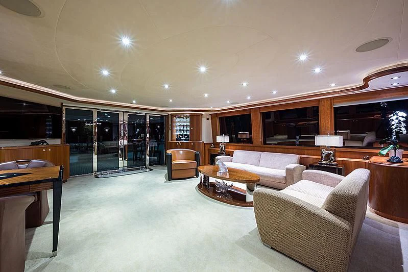 a living room with a couch and a table aboard SLEEPOVER Yacht for Sale