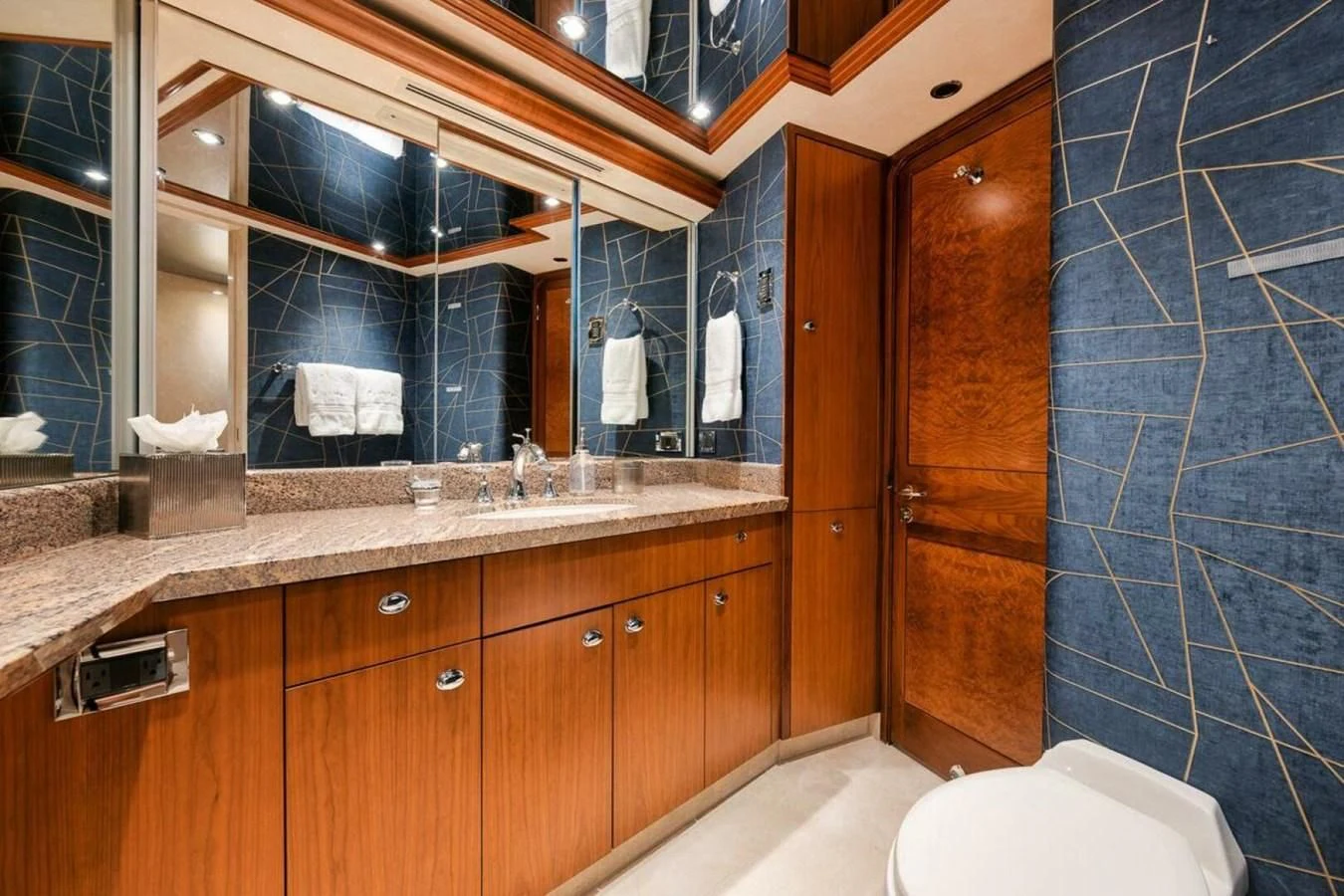 a bathroom with a sink and a toilet aboard SLEEPOVER Yacht for Sale