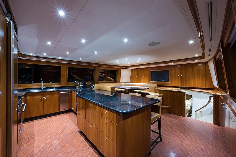 a large kitchen with a bar and bar aboard SLEEPOVER Yacht for Sale