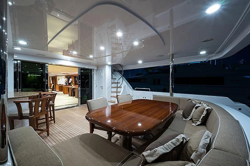 a living room with a large table and chairs aboard SLEEPOVER Yacht for Sale
