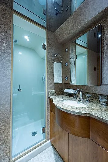 a bathroom with a glass shower door aboard SLEEPOVER Yacht for Sale