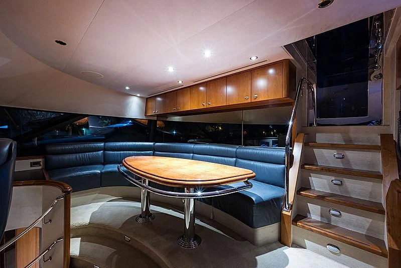 a room with a table and a chair aboard SLEEPOVER Yacht for Sale