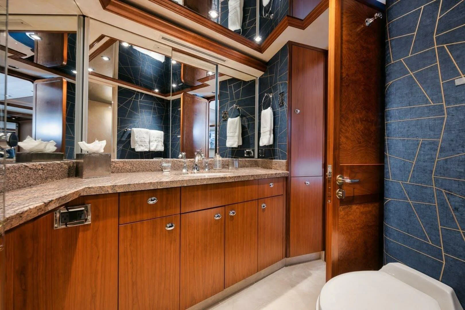 a bathroom with a sink and cabinets aboard SLEEPOVER Yacht for Sale