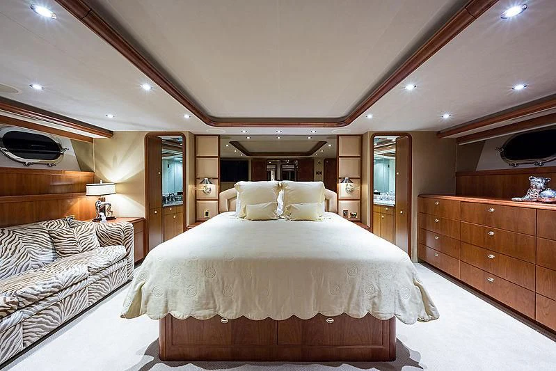 a room with a bed and a dresser aboard SLEEPOVER Yacht for Sale