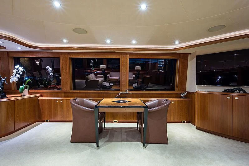 a room with a table and chairs aboard SLEEPOVER Yacht for Sale
