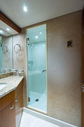 a bathroom with a glass shower aboard SLEEPOVER Yacht for Sale