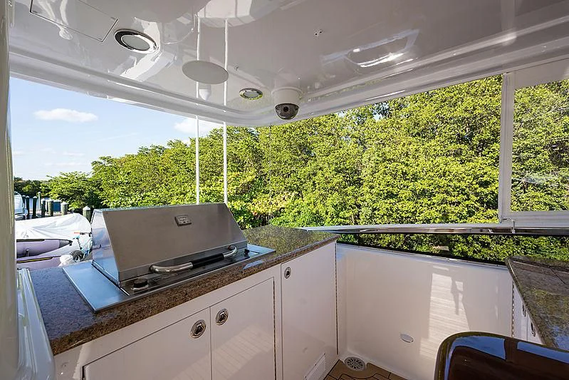 a kitchen with a stove and a large window aboard SLEEPOVER Yacht for Sale