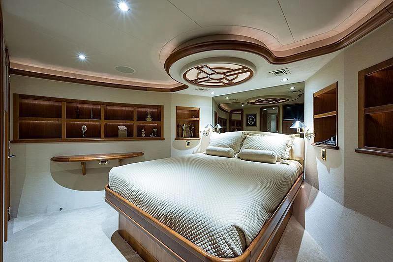 a large room with a bed and a table aboard SLEEPOVER Yacht for Sale