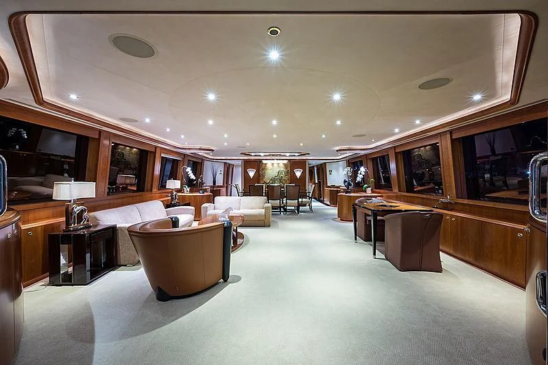 a large room with a table and chairs aboard SLEEPOVER Yacht for Sale