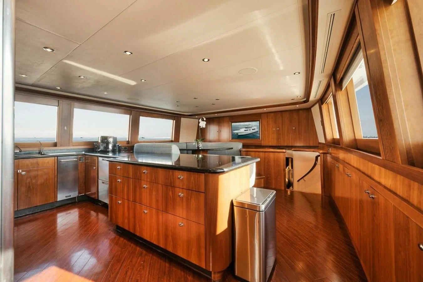 a kitchen with wooden cabinets aboard SLEEPOVER Yacht for Sale