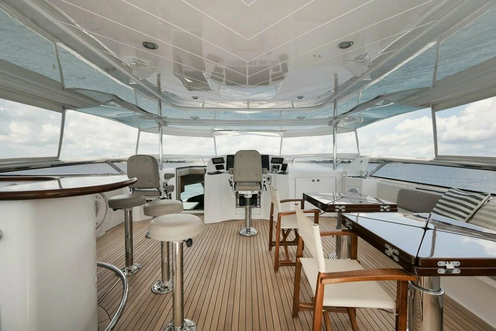 a room with chairs and tables aboard SLEEPOVER Yacht for Sale