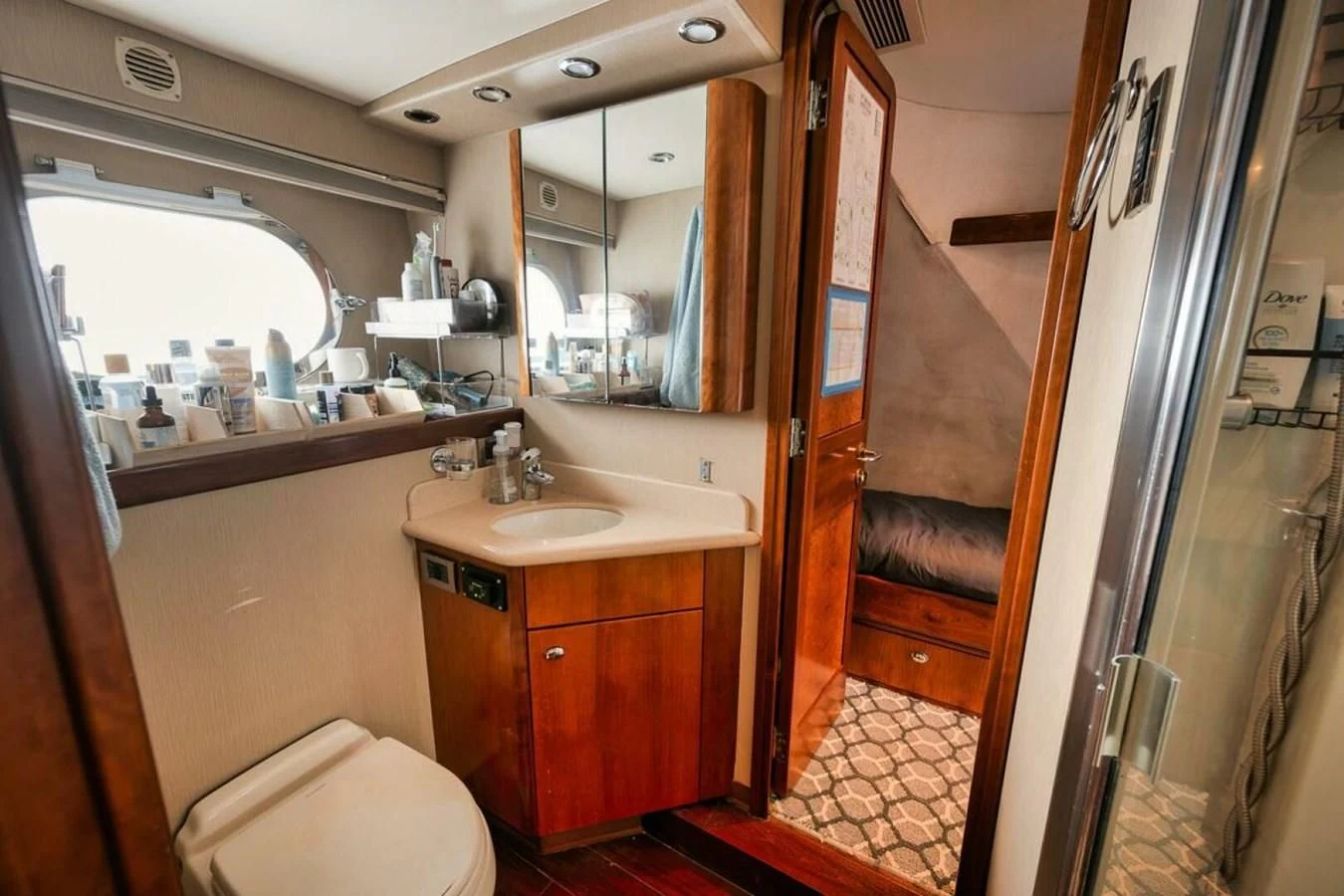 a bathroom with a sink and a mirror aboard SLEEPOVER Yacht for Sale