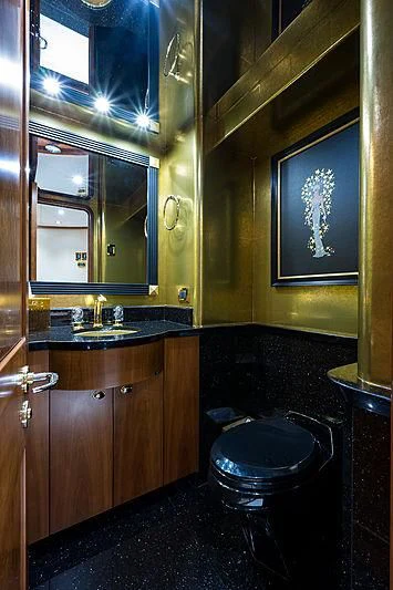 a bathroom with a sink and a mirror aboard SLEEPOVER Yacht for Sale