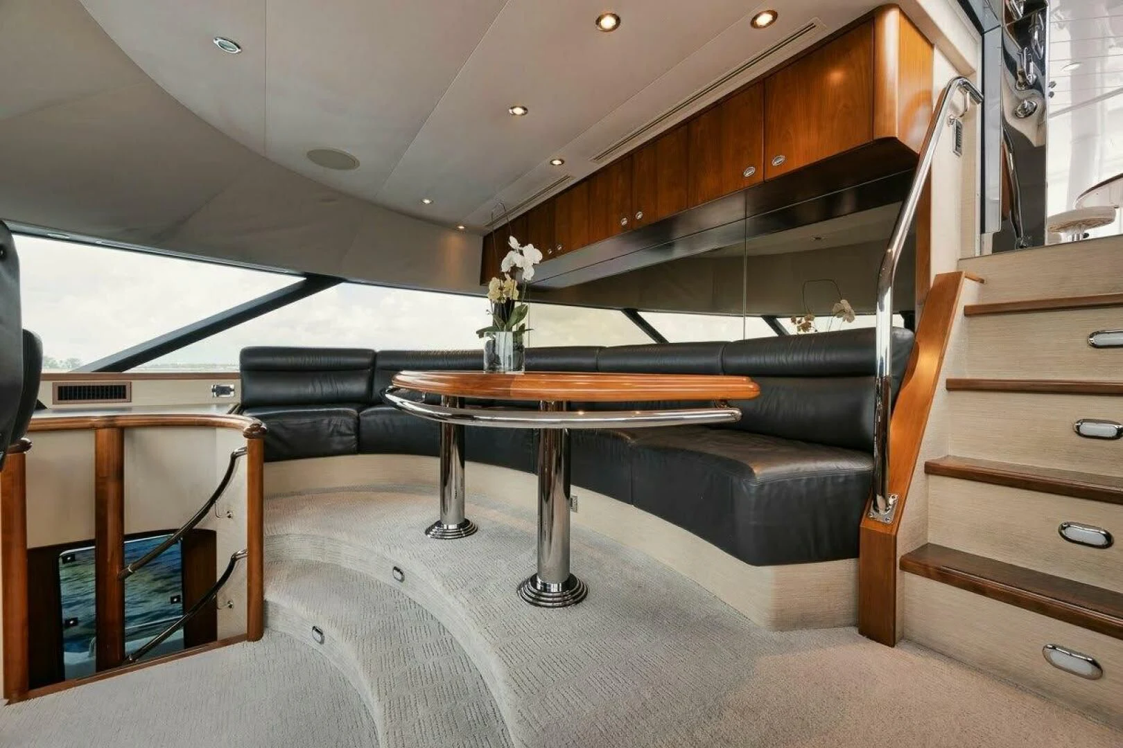 a room with a table and a couch aboard SLEEPOVER Yacht for Sale