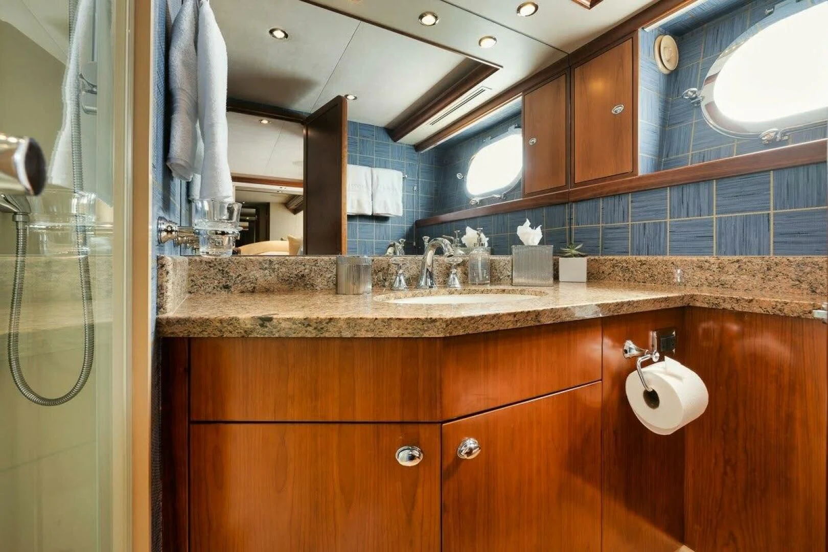 a bathroom with a countertop sink and mirror aboard SLEEPOVER Yacht for Sale
