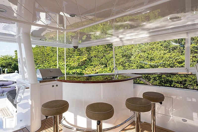 a room with stools and tables aboard SLEEPOVER Yacht for Sale
