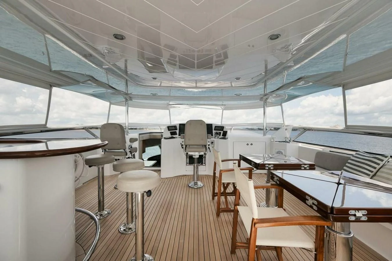 a room with chairs and tables aboard SLEEPOVER Yacht for Sale