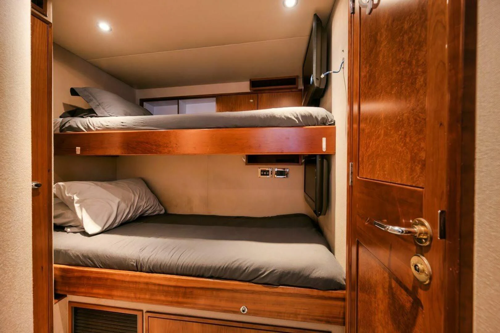 a closet with a bed and a door aboard SLEEPOVER Yacht for Sale