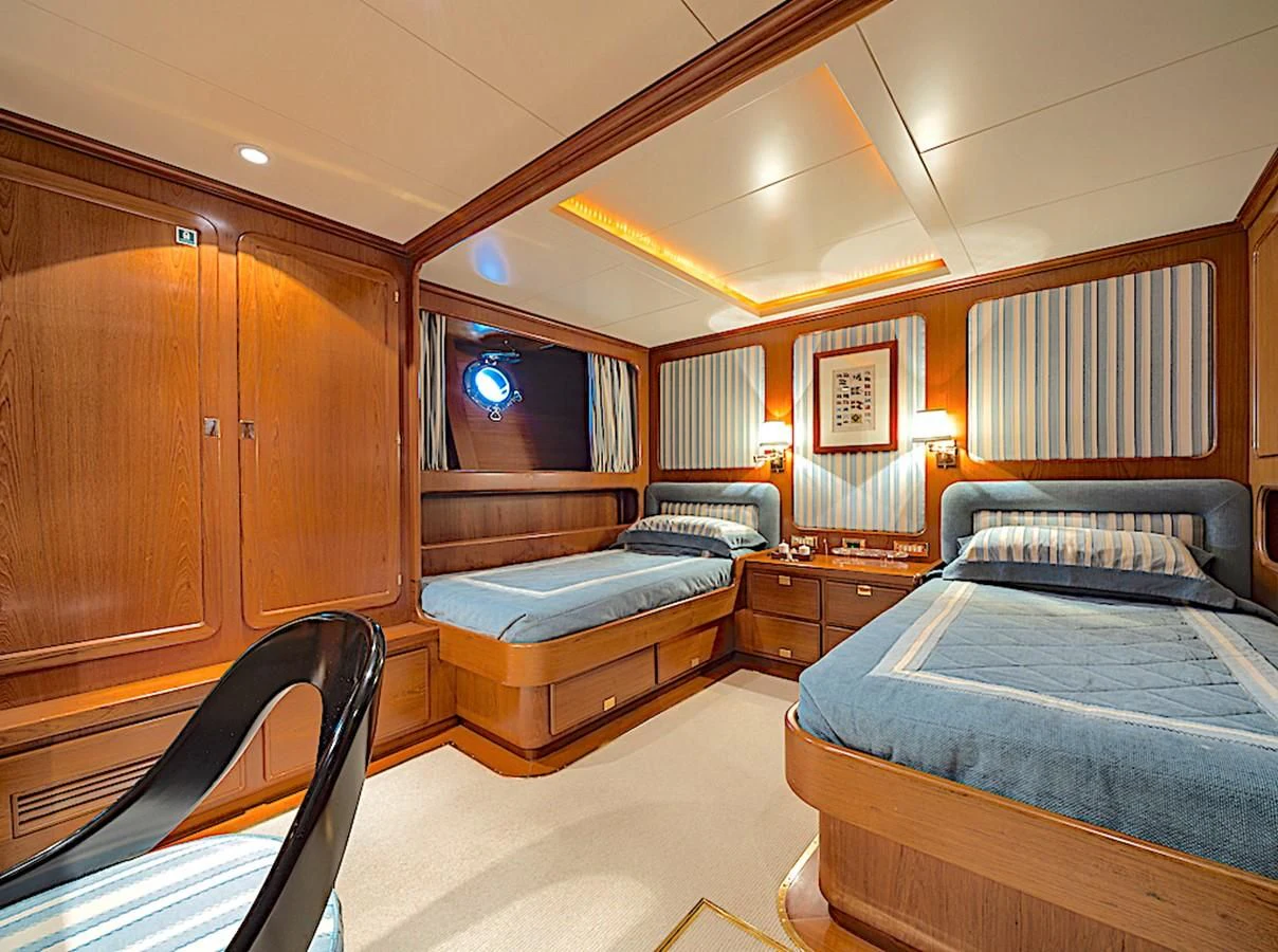 a room with two beds aboard TAMARITA Yacht for Sale