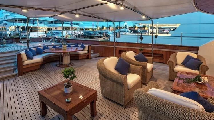 a large living room with a pool aboard TAMARITA Yacht for Sale