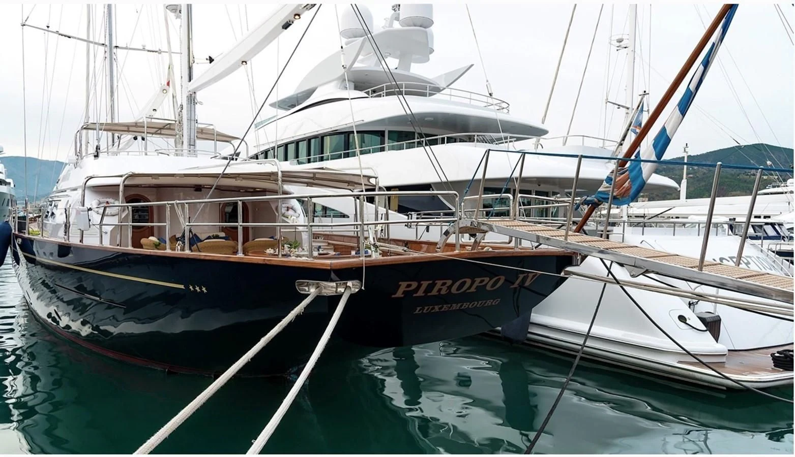 a boat docked at a pier aboard TAMARITA Yacht for Sale