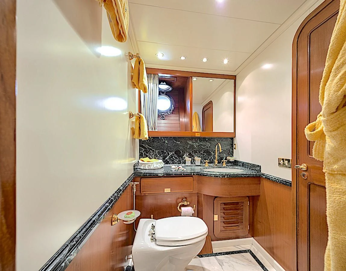 a bathroom with a sink and a toilet aboard TAMARITA Yacht for Sale