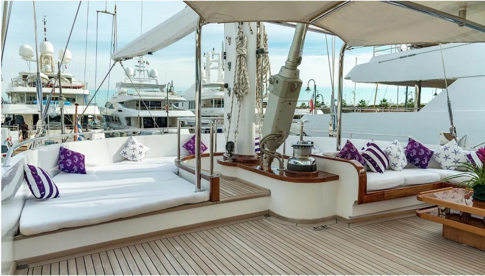 a room with a bed and a large white bed aboard TAMARITA Yacht for Sale