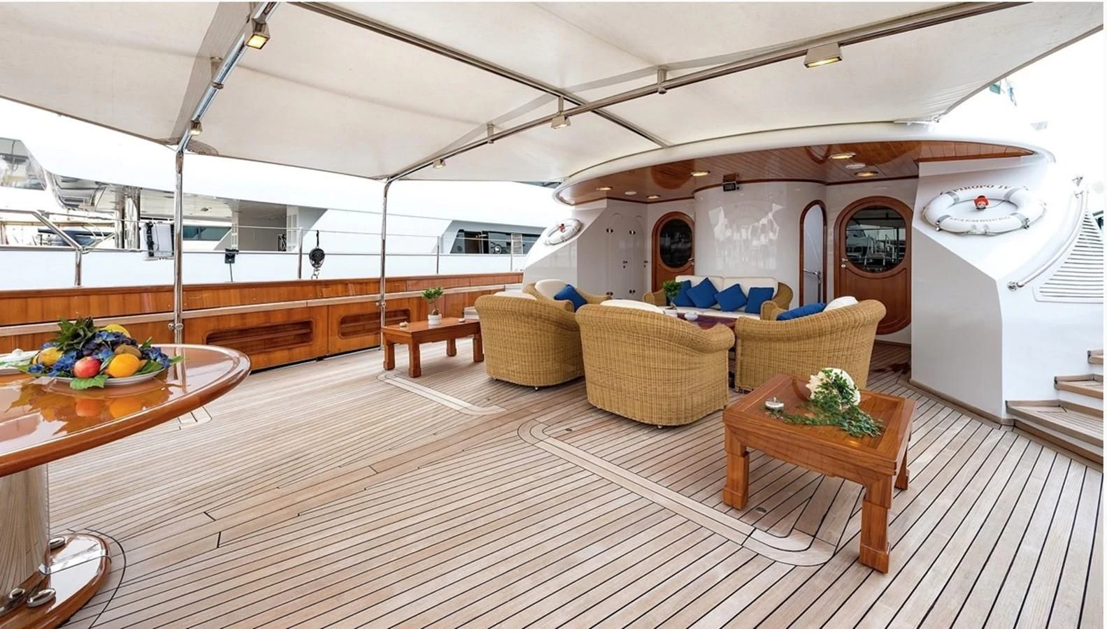 a kitchen with a table and chairs aboard TAMARITA Yacht for Sale