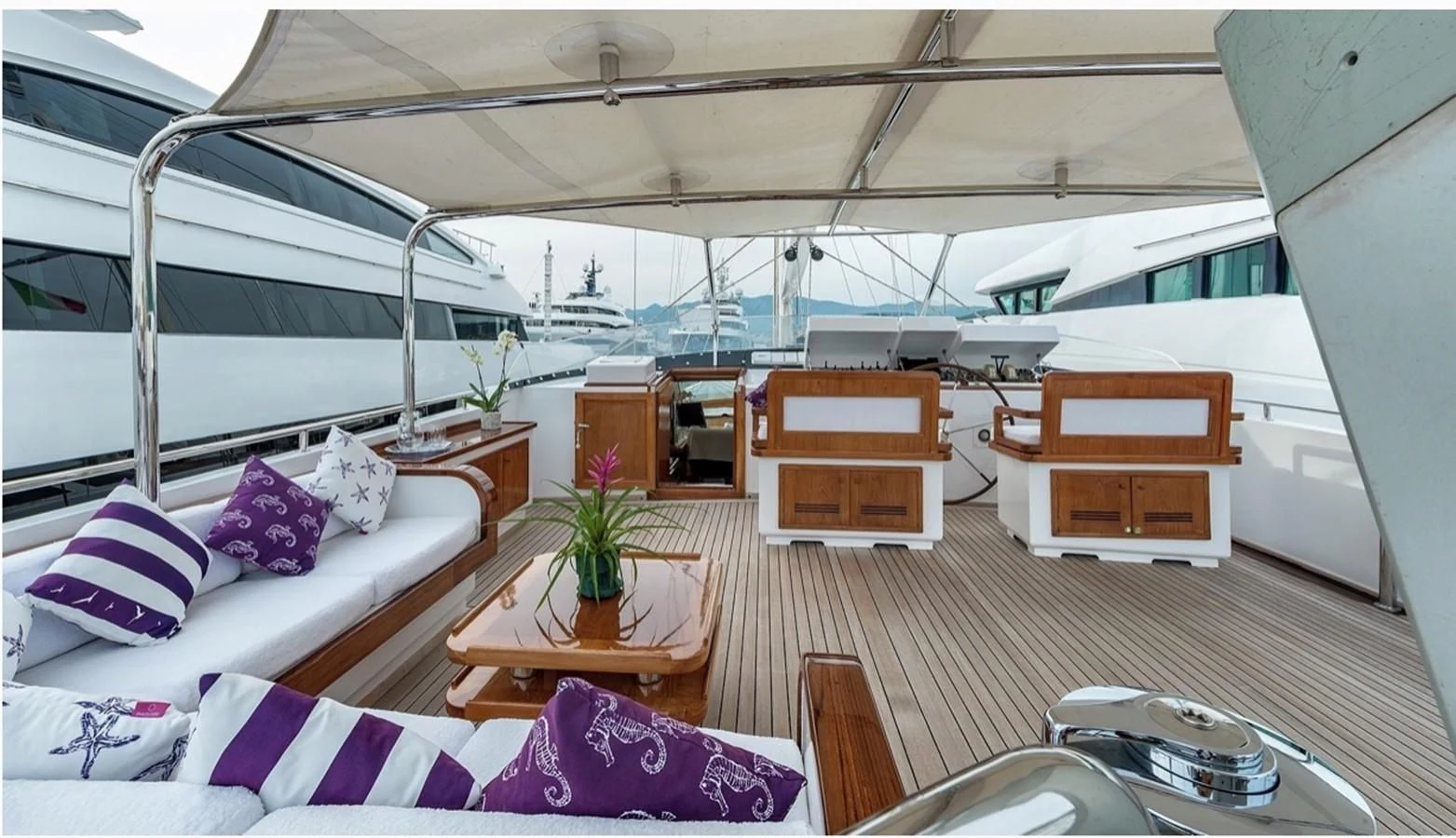 a room with a bed and a table aboard TAMARITA Yacht for Sale