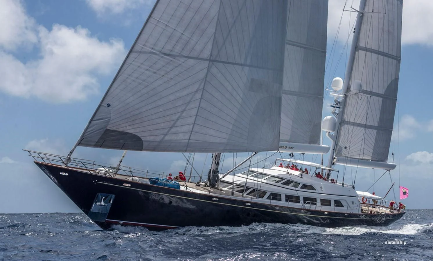 a large ship in the water aboard TAMARITA Yacht for Sale