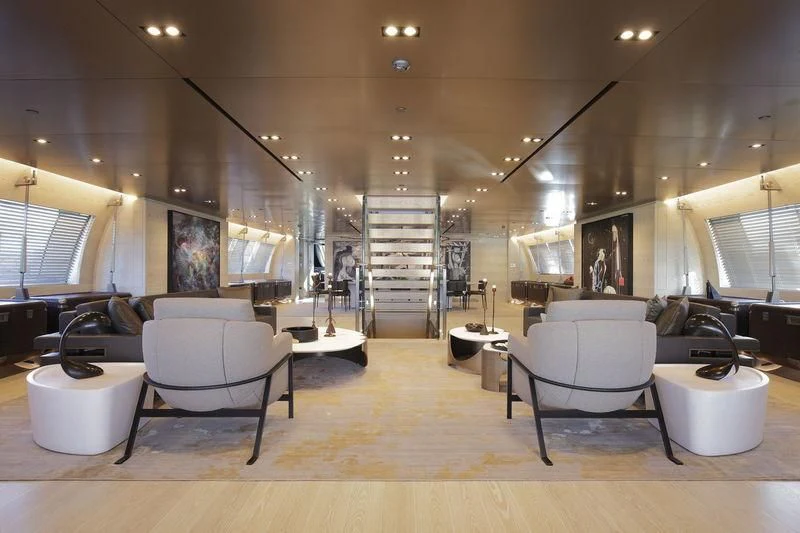 a room with chairs and a staircase aboard BADIS I Yacht for Sale