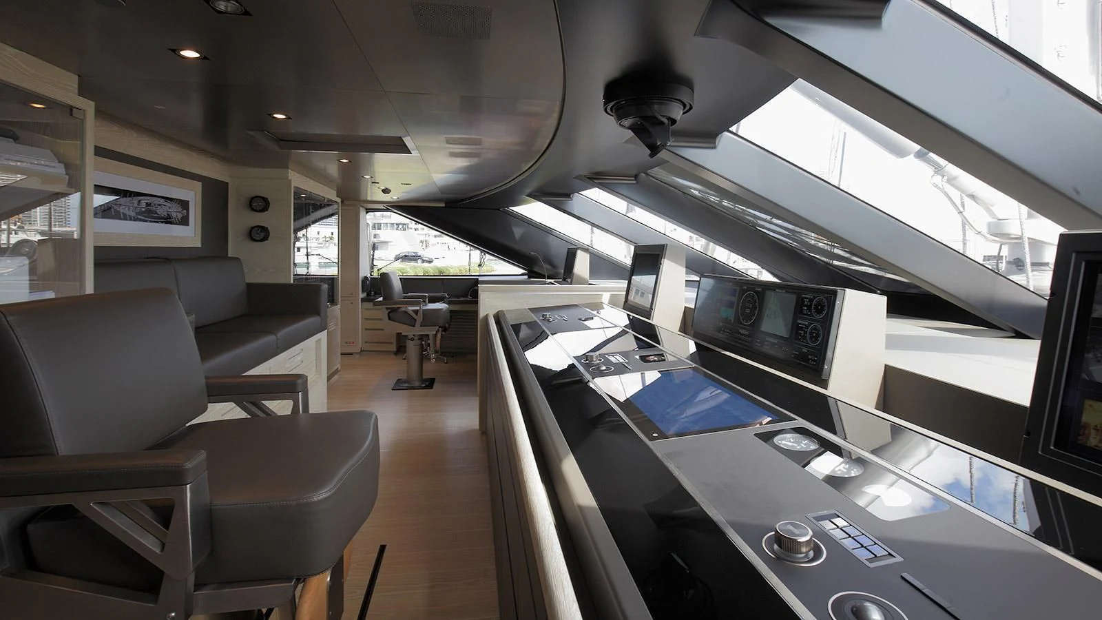 a room with a desk and chairs aboard BADIS I Yacht for Sale