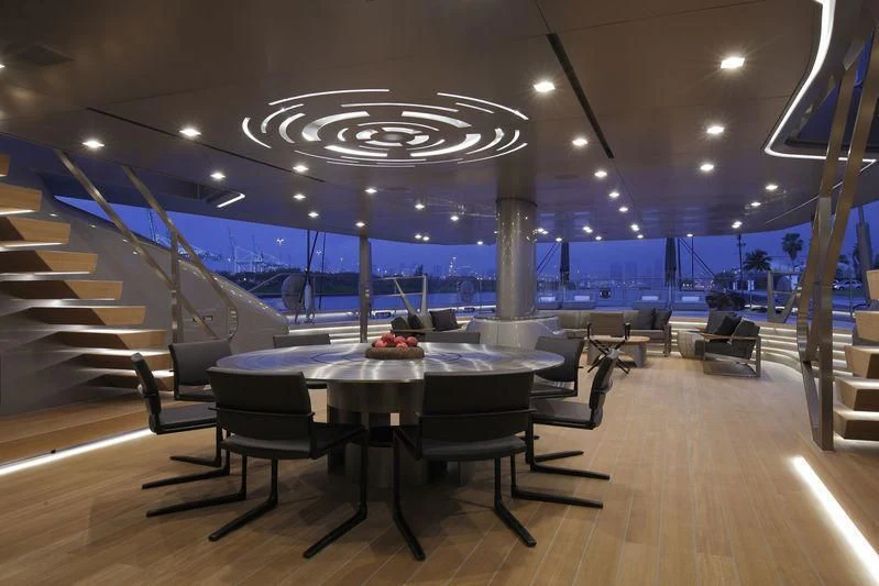 a room with a table and chairs aboard BADIS I Yacht for Sale