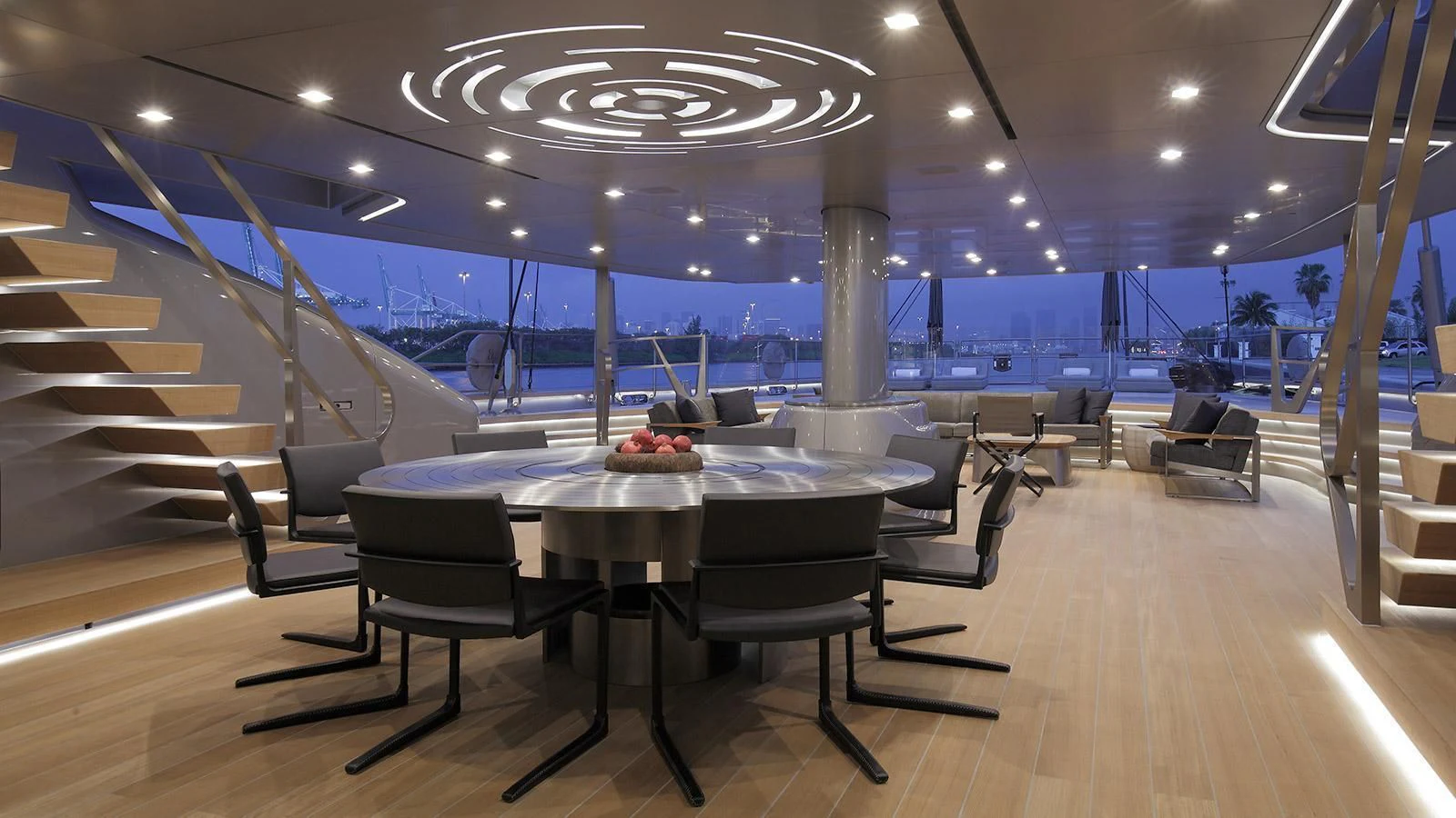 a room with a table and chairs aboard BADIS I Yacht for Sale