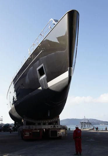 a person standing next to a large space ship aboard BADIS I Yacht for Sale