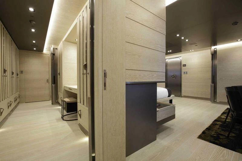 a room with a large door and a hallway with chairs aboard BADIS I Yacht for Sale