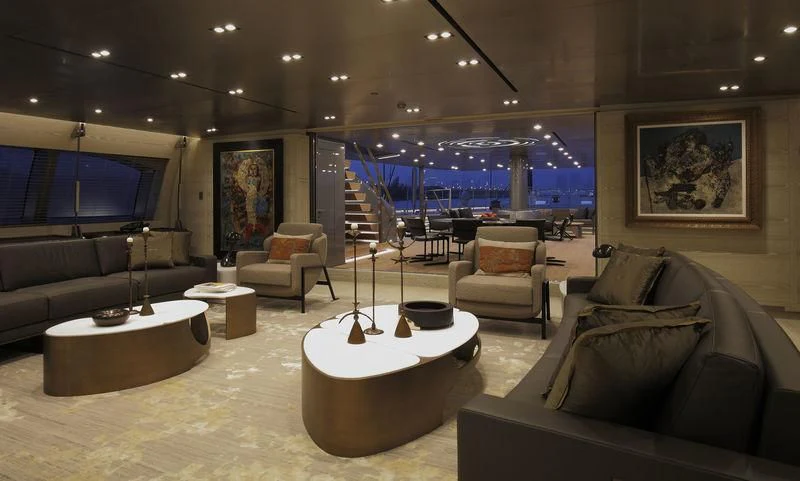 a living room with a large screen aboard BADIS I Yacht for Sale
