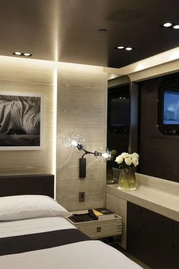 a room with a tv and bed aboard BADIS I Yacht for Sale