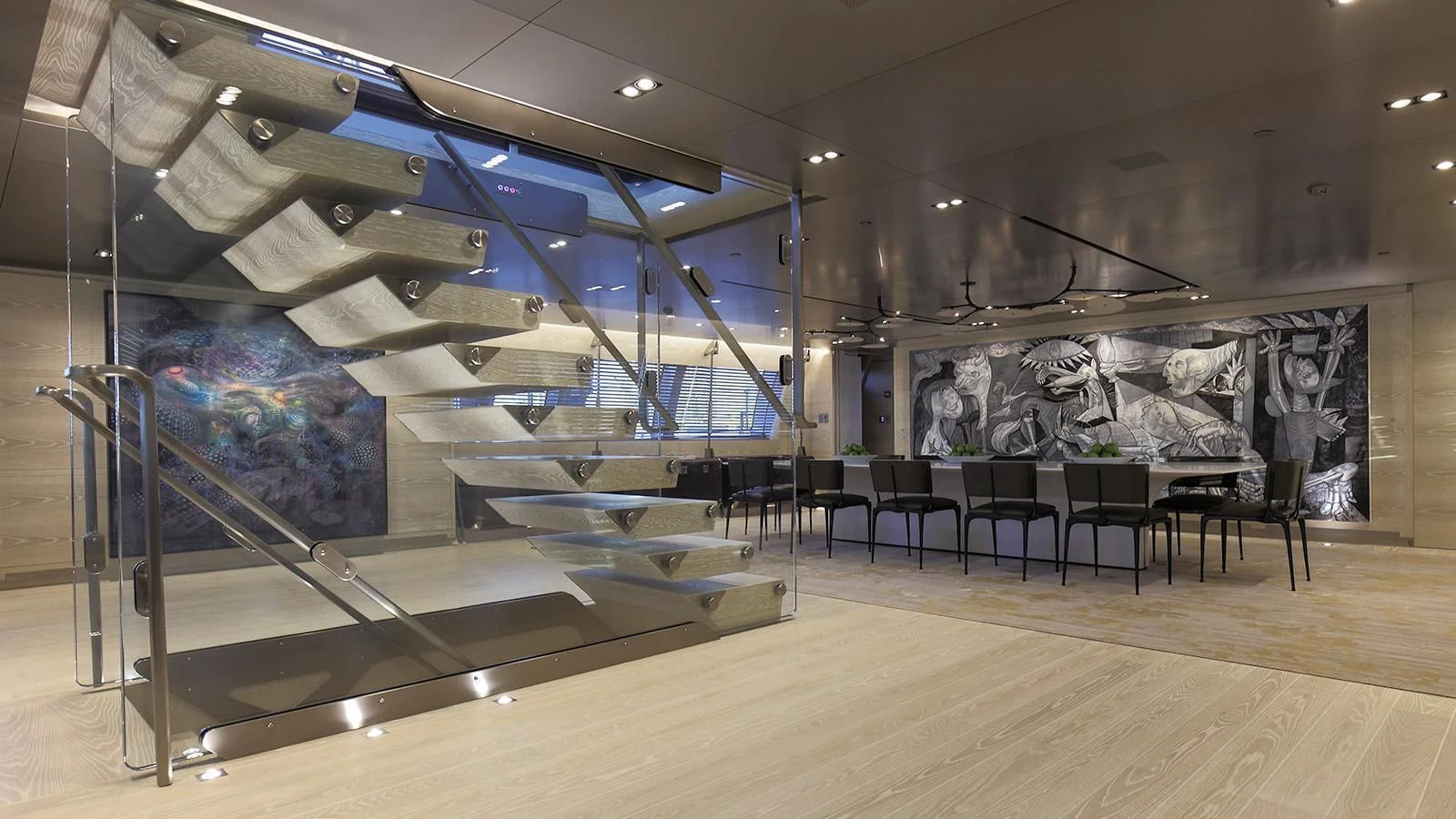a large room with a large glass wall and a large staircase aboard BADIS I Yacht for Sale