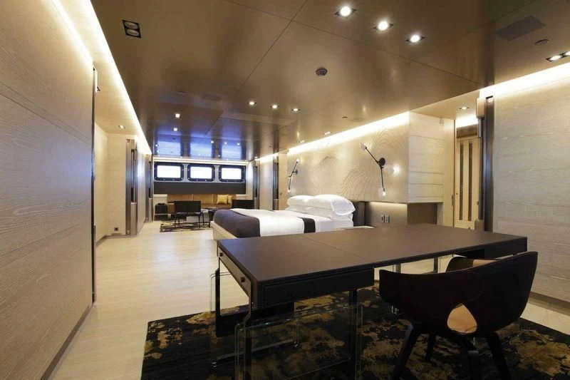 a room with a bed and a desk aboard BADIS I Yacht for Sale