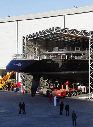 a group of people standing next to a large machine aboard BADIS I Yacht for Sale